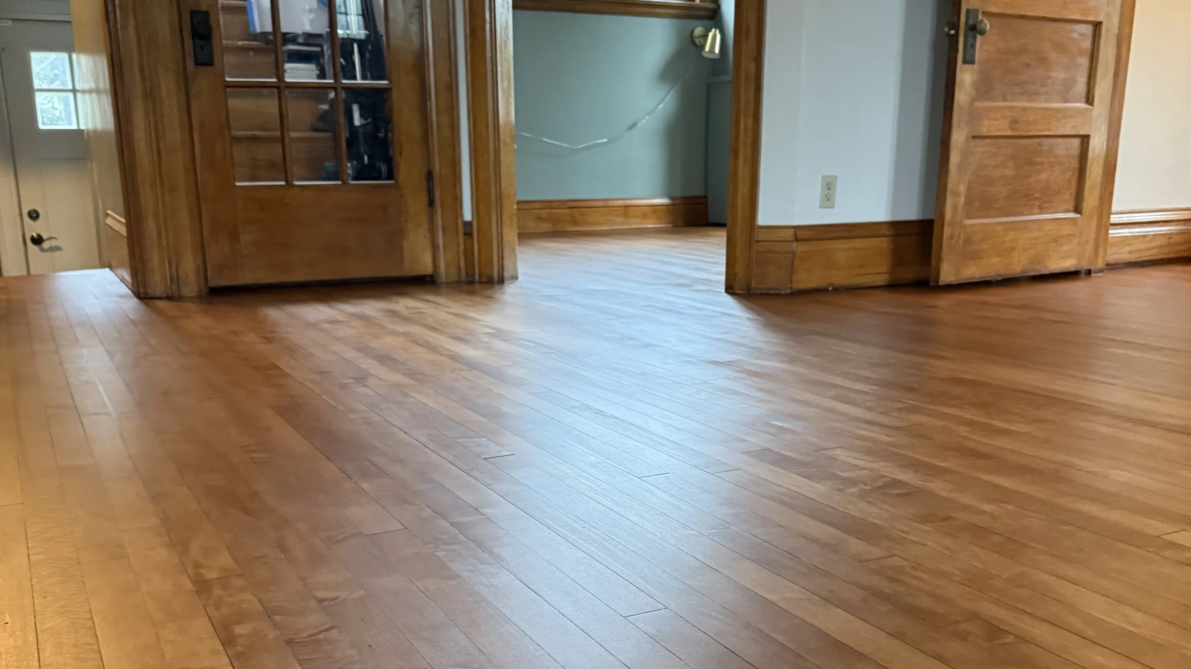 After — freshly refinished hardwood floor