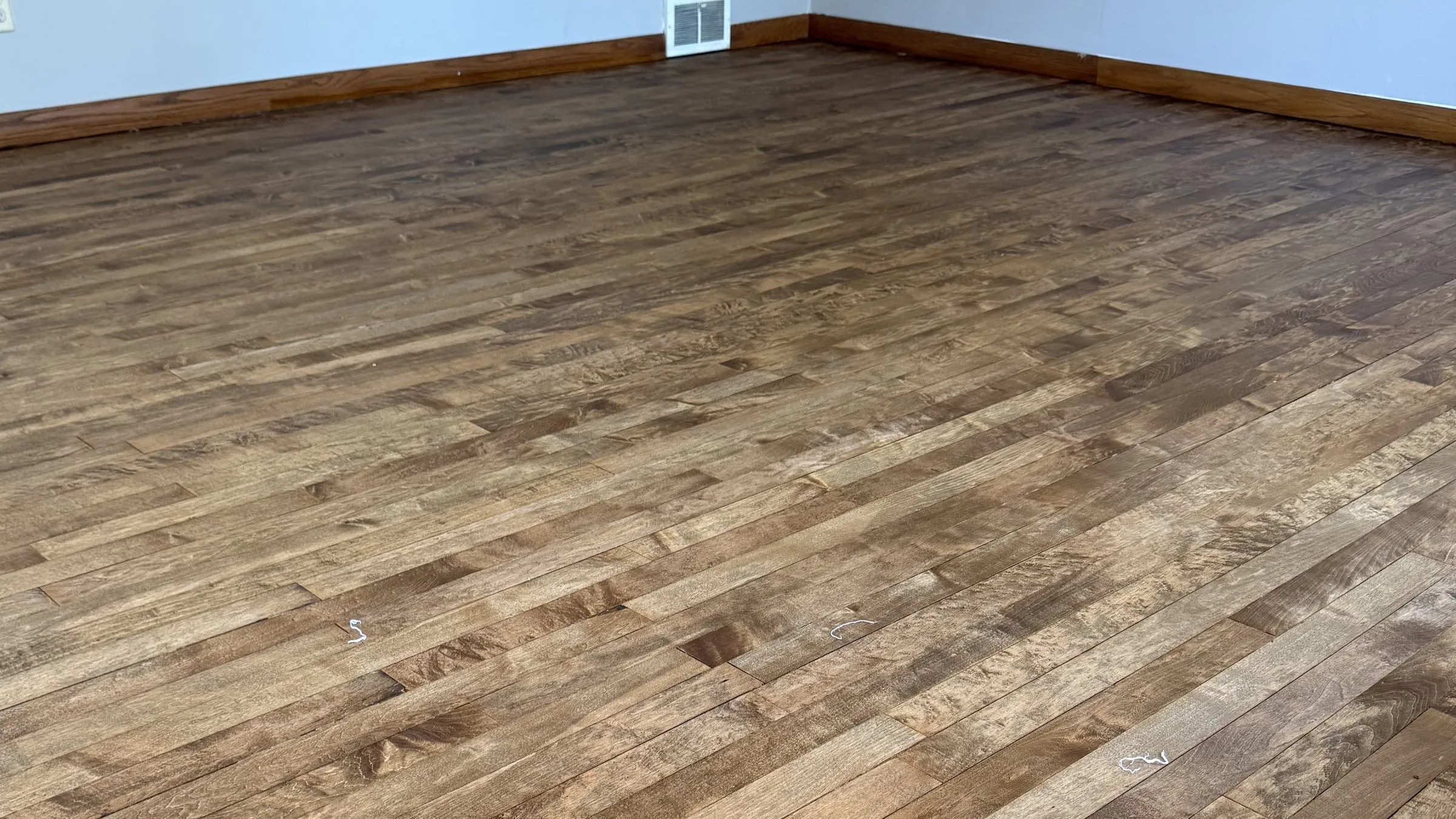 After — freshly refinished hardwood floor